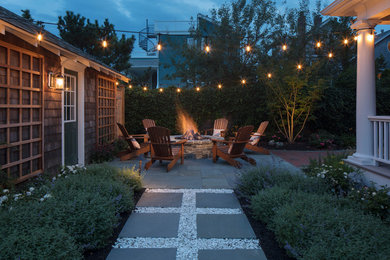 Mid-sized elegant backyard brick patio photo in Philadelphia with a fire pit and no cover