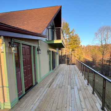 A Mountain Home Deck Elevated with Black Cable Railing