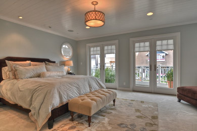 Traditional bedroom in Los Angeles with grey walls and carpet.
