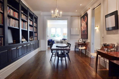 Inspiration for a large victorian medium tone wood floor enclosed dining room remodel in San Francisco
