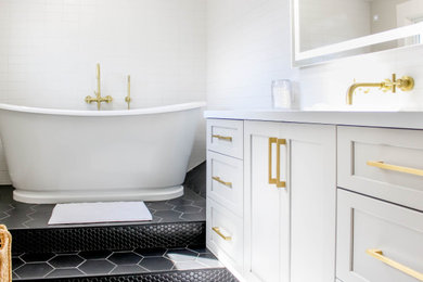 Inspiration for a transitional master black floor and single-sink freestanding bathtub remodel in Other with shaker cabinets, a wall-mount sink, a hinged shower door and a built-in vanity