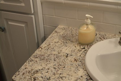Bathroom - white tile mosaic tile floor bathroom idea in Wichita with blue walls