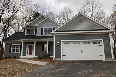 Inspiration for a mid-sized timeless gray two-story house exterior remodel in Providence