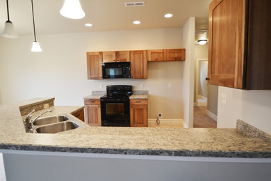 Example of a classic kitchen design in Other