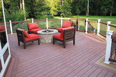 Mid-sized elegant backyard deck photo in Boston with a fire pit and no cover