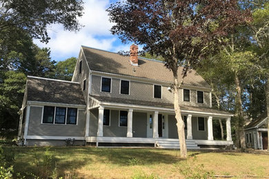 Large traditional gray two-story wood exterior home idea in Boston with a shingle roof