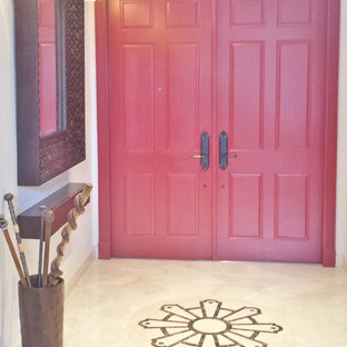 This is an example of a mid-sized eclectic front door in Miami with beige walls, marble floors, a double front door and a red front door.