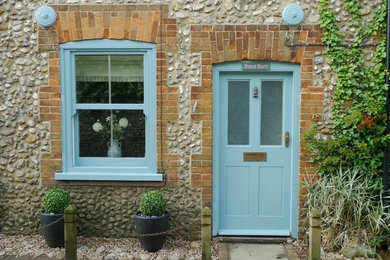 Design ideas for a small beach style front door in Other with a single front door and a blue front door.