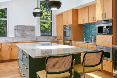 Eat-in kitchen - large 1960s u-shaped medium tone wood floor, brown floor and vaulted ceiling eat-in kitchen idea in New York with an undermount sink, flat-panel cabinets, medium tone wood cabinets, quartzite countertops, multicolored backsplash, stone slab backsplash, stainless steel appliances, an island and multicolored countertops