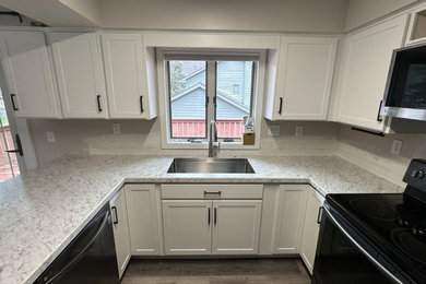 Mid-sized transitional u-shaped eat-in kitchen photo in Other with shaker cabinets, white cabinets and laminate countertops