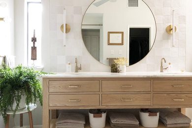 Minimalist master white tile and ceramic tile porcelain tile, beige floor, double-sink and vaulted ceiling bathroom photo in Dallas with flat-panel cabinets, light wood cabinets, white walls, an undermount sink, marble countertops, a hinged shower door, white countertops and a freestanding vanity