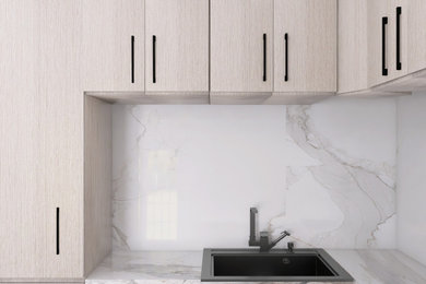 Inspiration for a mid-sized modern u-shaped enclosed kitchen remodel in Atlanta with a drop-in sink, flat-panel cabinets, light wood cabinets, granite countertops, gray backsplash, granite backsplash, stainless steel appliances, a peninsula and gray countertops