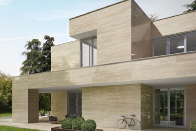 Design ideas for a large modern two-storey beige exterior in Buckinghamshire with stone veneer and a flat roof.