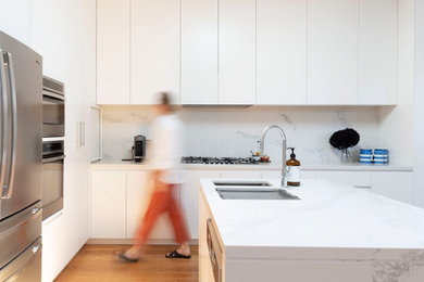 Photo of a contemporary l-shaped kitchen in Other with with island.