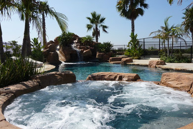 Mid-sized island style pool photo in Orange County
