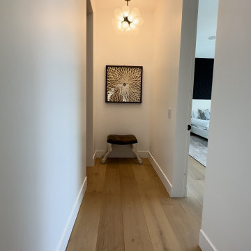 Wide Hallway with White Oak Flooring and Gallery Wall - Studio City
