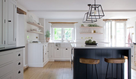 White Cabinets and Oak Shelves Refresh an English Country Kitchen