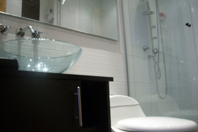 This is an example of a small modern bathroom in Other with a one-piece toilet, white tiles, ceramic tiles, white walls, slate flooring, a vessel sink and multi-coloured floors.