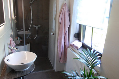 Inspiration for a medium sized contemporary shower room bathroom with a built-in shower, white tiles, ceramic tiles, white walls, a vessel sink, granite worktops, brown floors, brown worktops, a shower bench, a single sink and a floating vanity unit.