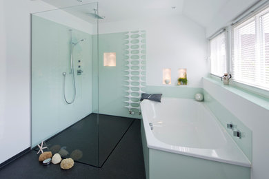 Design ideas for a large coastal ensuite bathroom in Hamburg with flat-panel cabinets, white cabinets, a built-in bath, a walk-in shower, a two-piece toilet, green tiles, glass sheet walls, white walls, marble flooring, a vessel sink, granite worktops and an open shower.