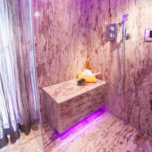 Photo of a mid-sized tropical master bathroom in Cologne with stone slab and marble floors.