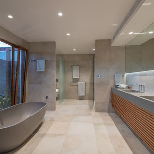 Design ideas for a tropical powder room in Sunshine Coast.
