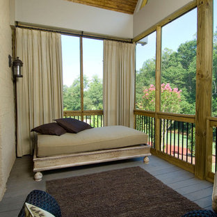 Example of a classic privacy balcony design in Other with a roof extension