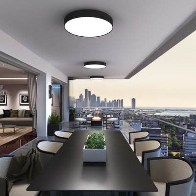 Inspiration for a huge contemporary balcony remodel in Chicago with a roof extension