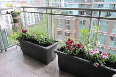 Small trendy balcony photo in Vancouver with a roof extension