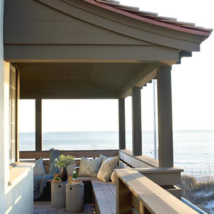 Inspiration for a coastal balcony remodel in Atlanta with a roof extension