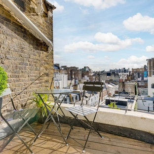 Design ideas for a small contemporary apartment metal railing balcony in London with no cover.