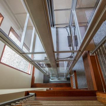Boxborough Deck House with Modern Home Elevator