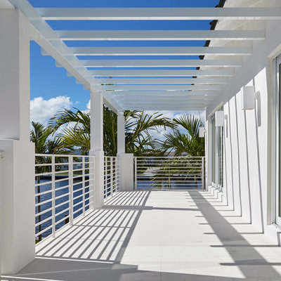 Large trendy balcony photo in Miami with a pergola