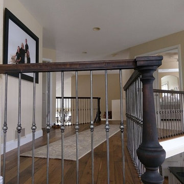 Dramatic Entry with Custom Walnut Staircase and Handrail