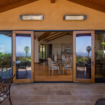 Folding Door Systems Create Open-Air Dining in a Spanish Style Home