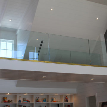 Glass Balustrade with Aluminum Base Rail Finished with Satin Brass Cladding
