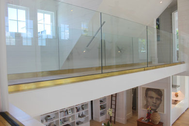 Glass Balustrade with Aluminum Base Rail Finished with Satin Brass Cladding