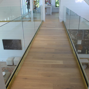 Glass Balustrade with Aluminum Base Rail Finished with Satin Brass Cladding