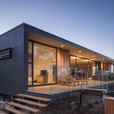 Mid-sized trendy glass railing balcony photo in Perth with a roof extension