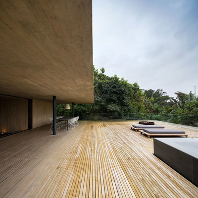 Balcony - huge modern balcony idea in Other with a roof extension