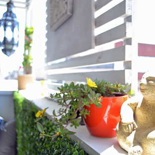 Inspiration for a small mediterranean mixed material railing vertical balcony garden remodel in Los Angeles with a roof extension
