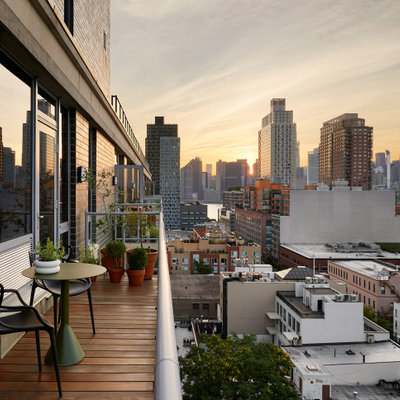 Balcony - small contemporary glass railing balcony idea in New York with no cover