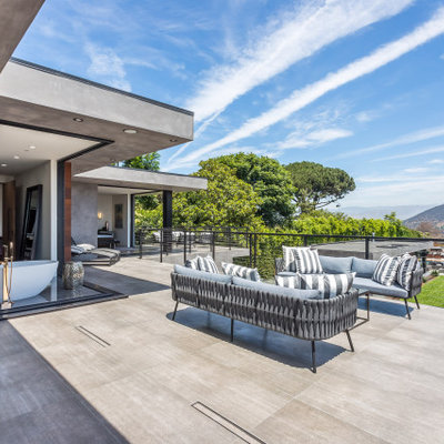 Inspiration for a large contemporary metal railing balcony remodel in Los Angeles with no cover