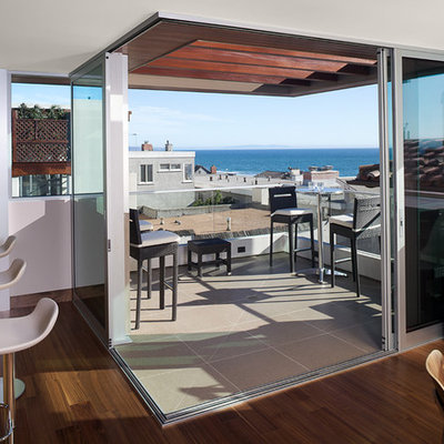 Balcony - contemporary balcony idea in Los Angeles with a pergola