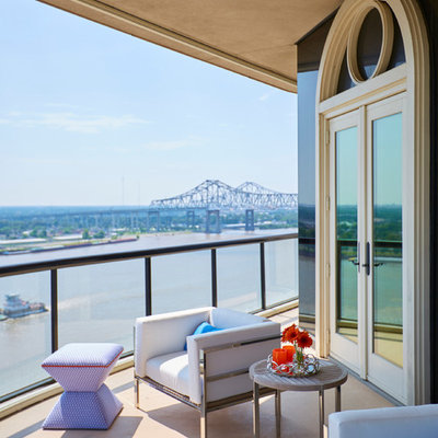 Example of a mid-sized trendy balcony design in New Orleans with a roof extension