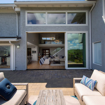Open-Air Living with Large Glass Multi-Slide Patio Door x Transom Combination