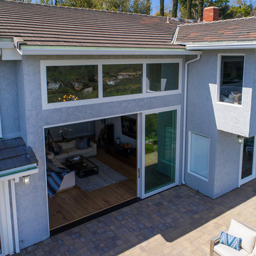 Open-Air Living with Large Glass Multi-Slide Patio Door x Transom Combination