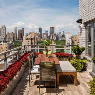 Example of a mid-sized minimalist balcony design in New York with no cover