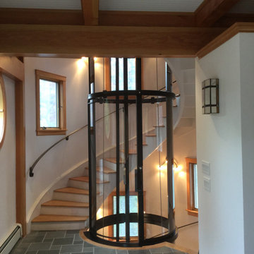 Round Acrylic Home Elevator Incorporated into Staircase