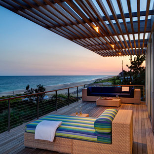Minimalist balcony photo in New York with a pergola